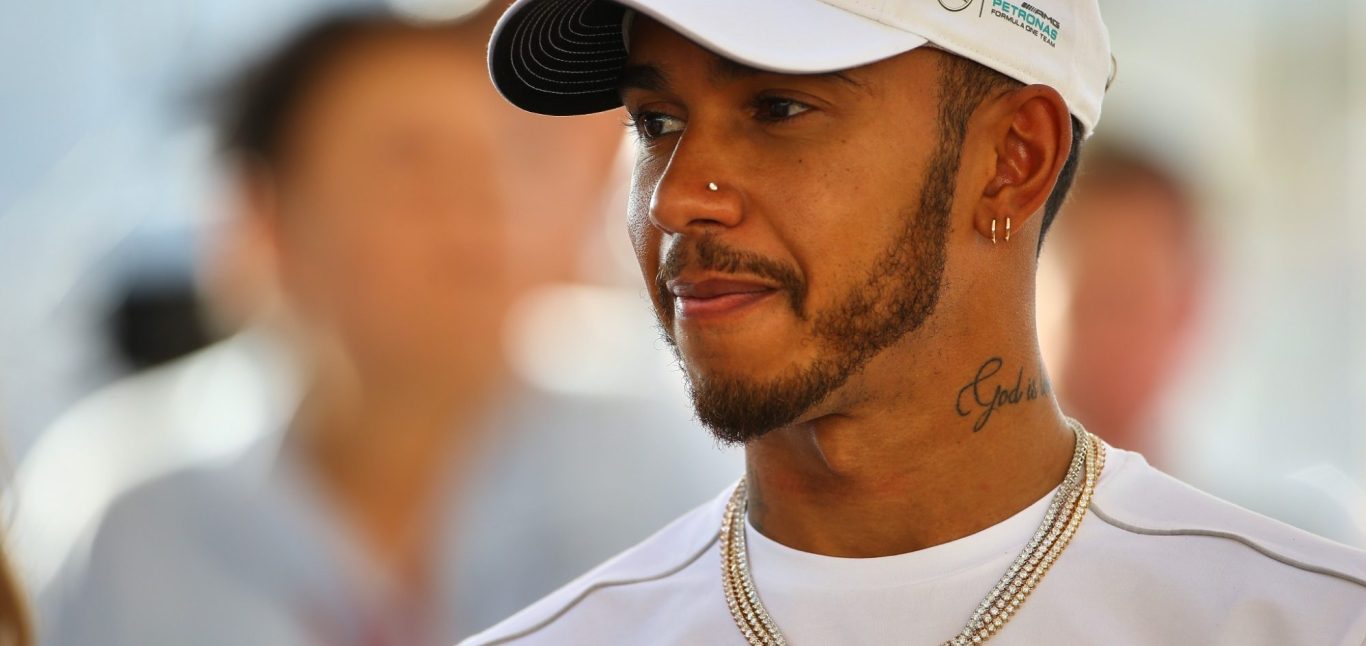 Lewis Hamilton in paddock looking relaxed