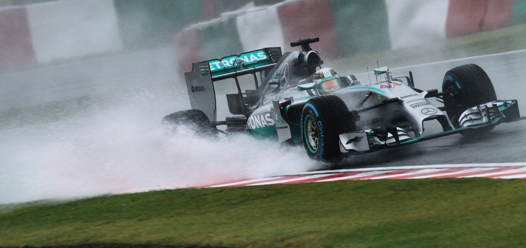 Lewis Hamilton racing in Suzuka wet weather